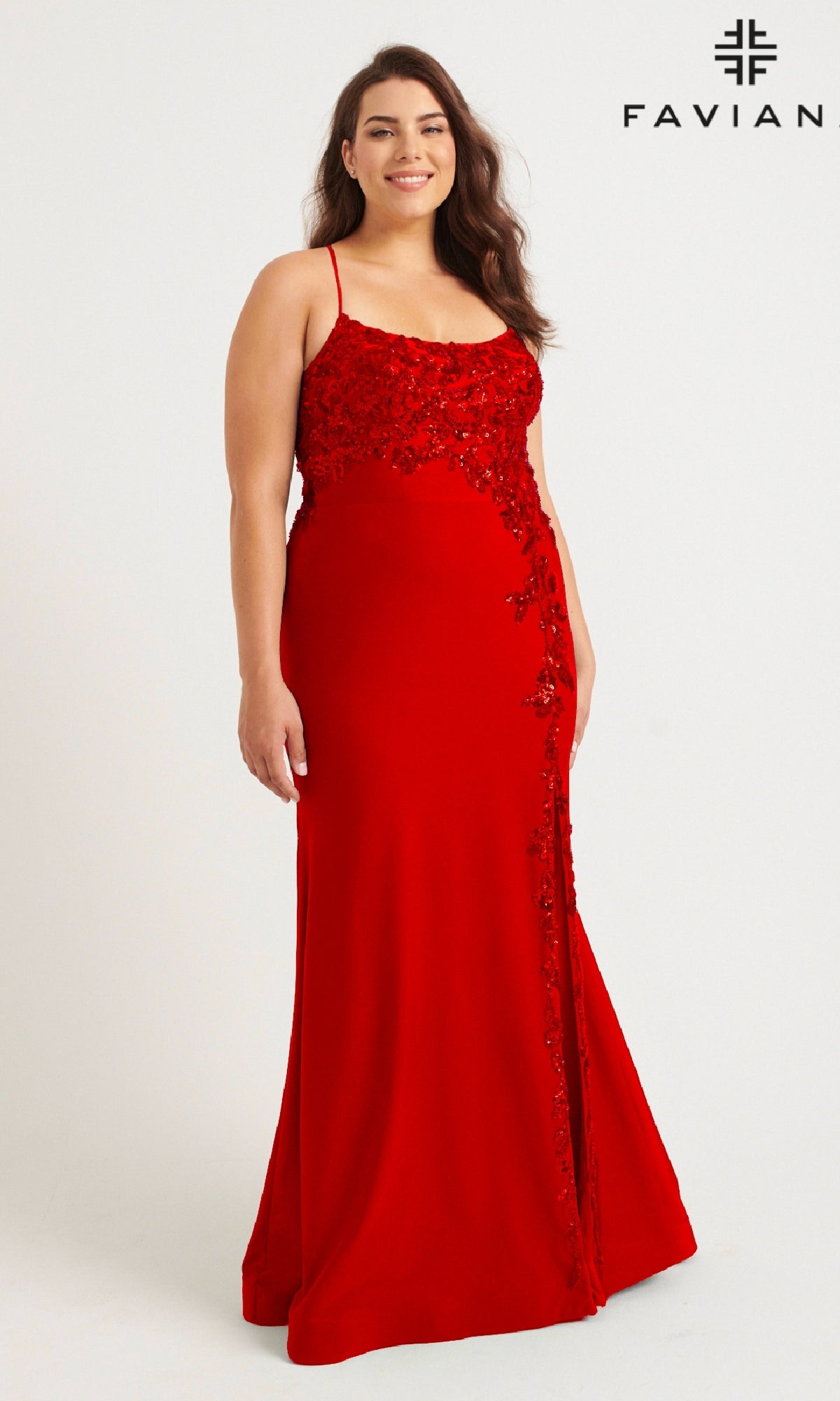 A woman models the Faviana 9570 Plus-Size Strappy Long Prom Dress—sleeveless, floor-length, red with sequin floral designs—against a white background.